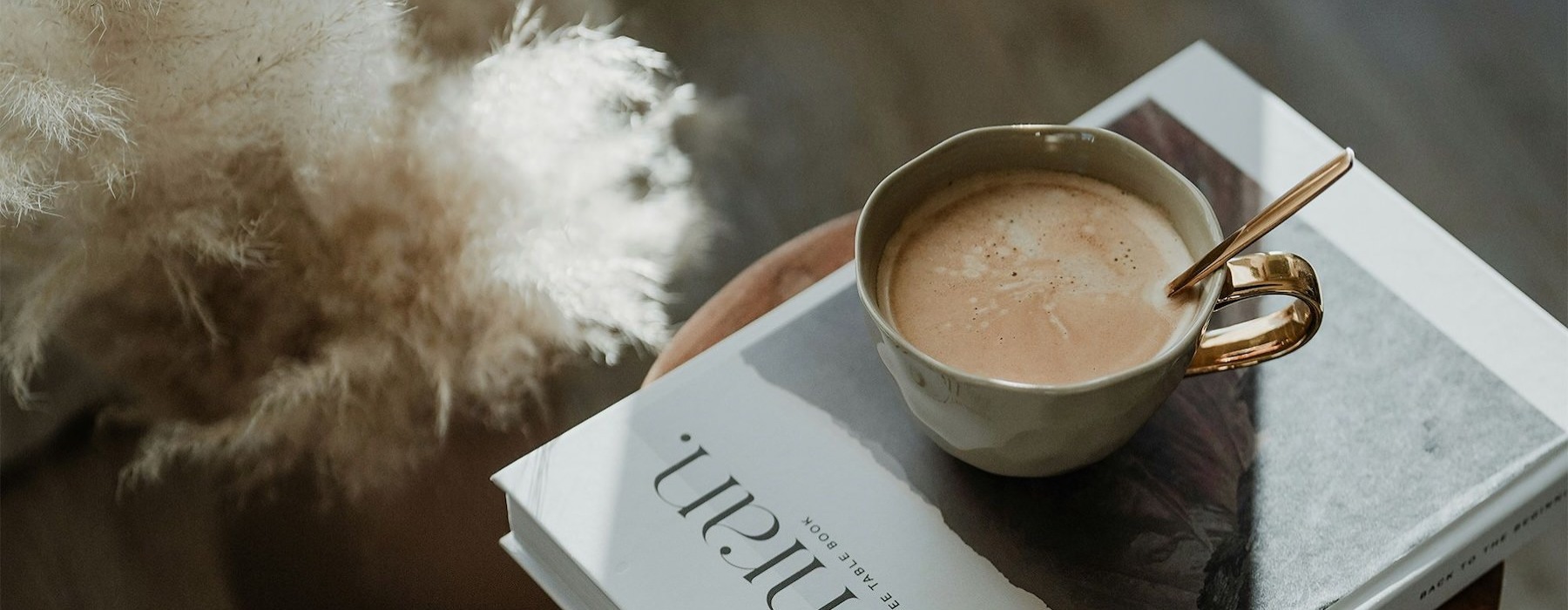 a cup of coffee on a book