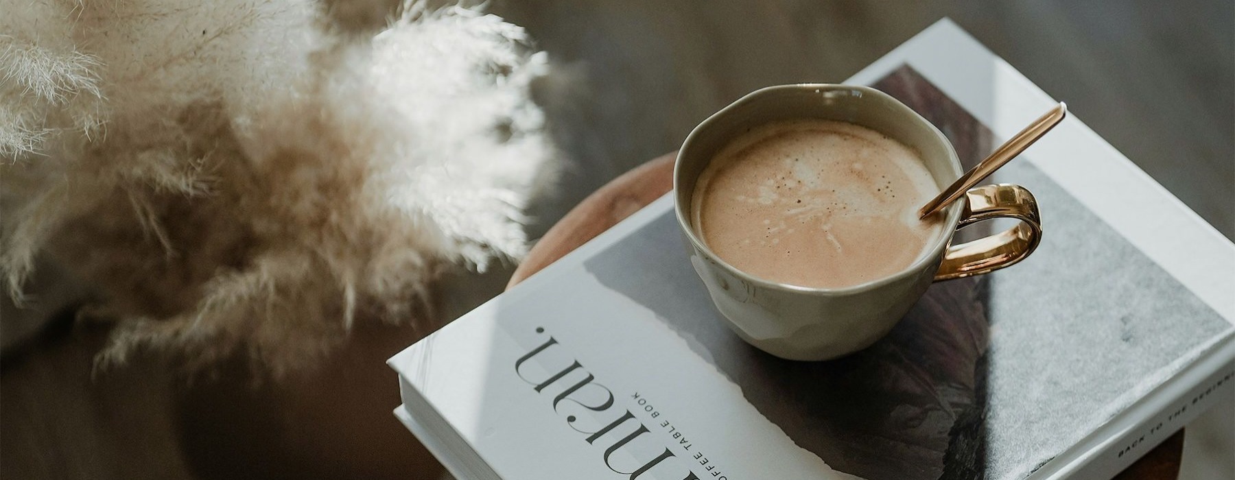 a cup of coffee on a book